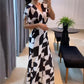 👗Damesjumpsuit met V-hals en geometrische print