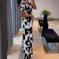 👗Damesjumpsuit met V-hals en geometrische print