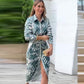 Elegante damesjurk met geometrische print en split