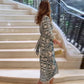 Elegante damesjurk met geometrische print en split