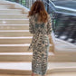 Elegante damesjurk met geometrische print en split