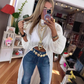 Asymmetrische top met opstaande kraag en pofmouwen