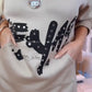 Trui met capuchon, ritssluiting bij de hals en letterprint